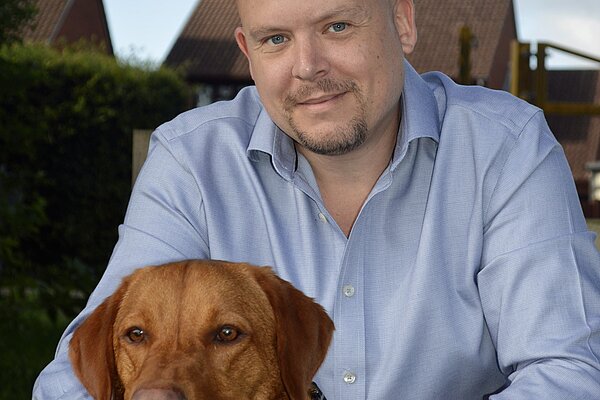 Cameron Thomas with a Dog