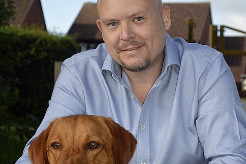 Cameron Thomas with a Dog