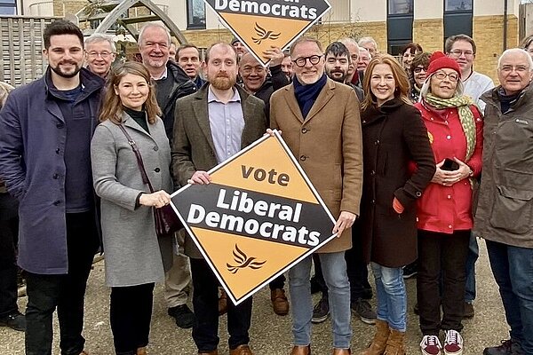 Paul and the Cotswolds Liberal Democrats Team hold Liberal Democrat Diamond Signs
